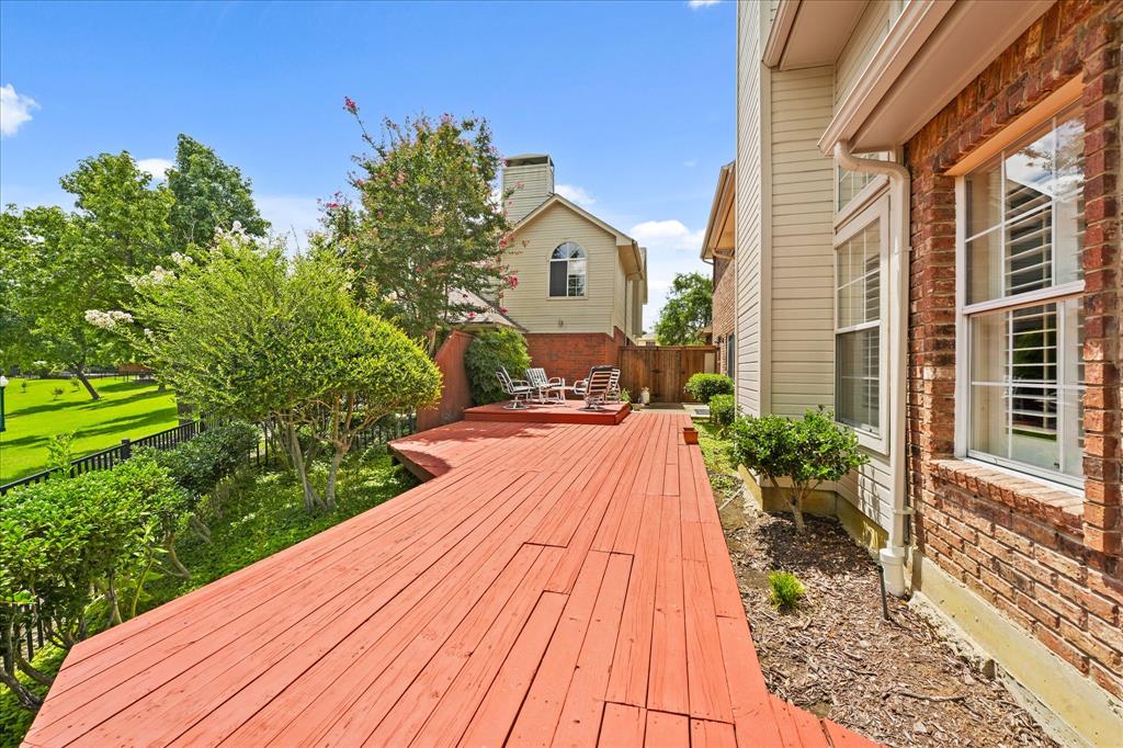 9420 Blue Jay Way Irving, TX 75063 - Photo 22 of 27 a front view of a house with a yard