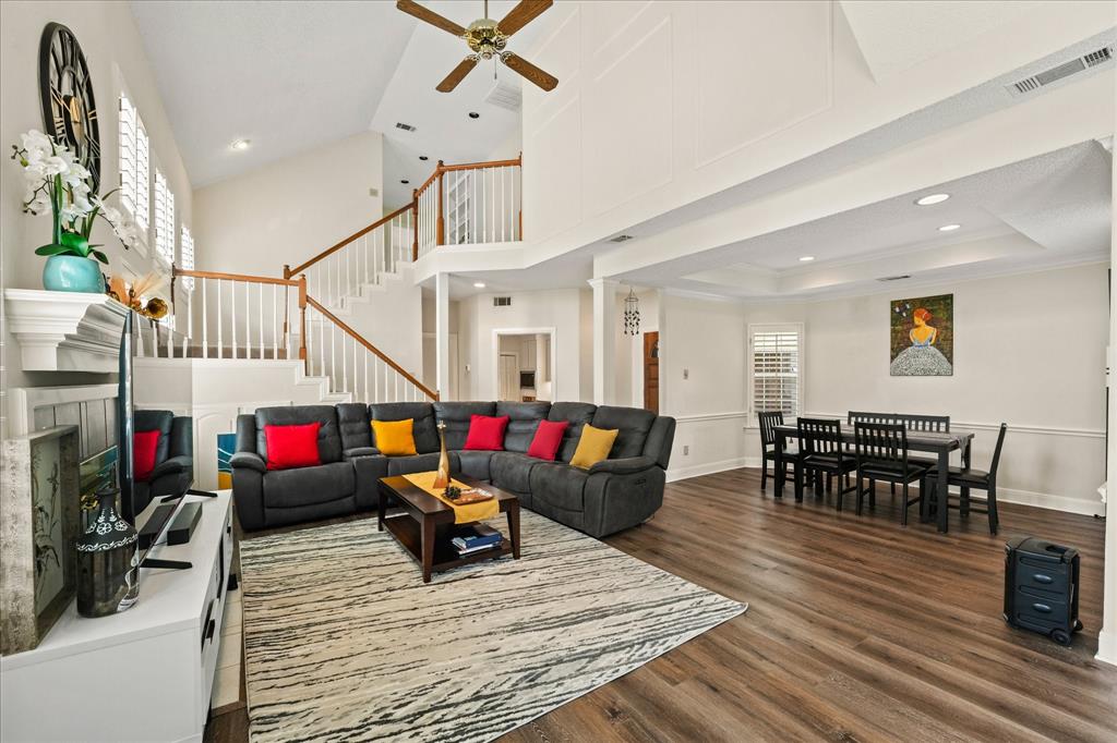 9420 Blue Jay Way Irving, TX 75063 - Photo 8 of 27 a living room with lots of furniture and a wooden floor