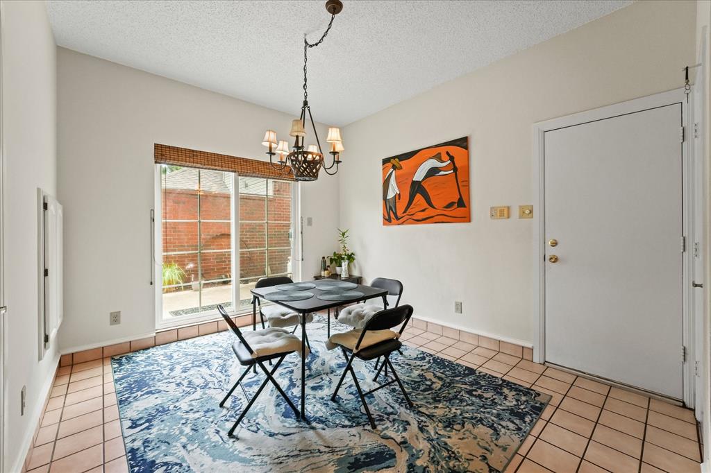 9420 Blue Jay Way Irving, TX 75063 - Photo 10 of 27 a view of a dining room with furniture window and wooden floor