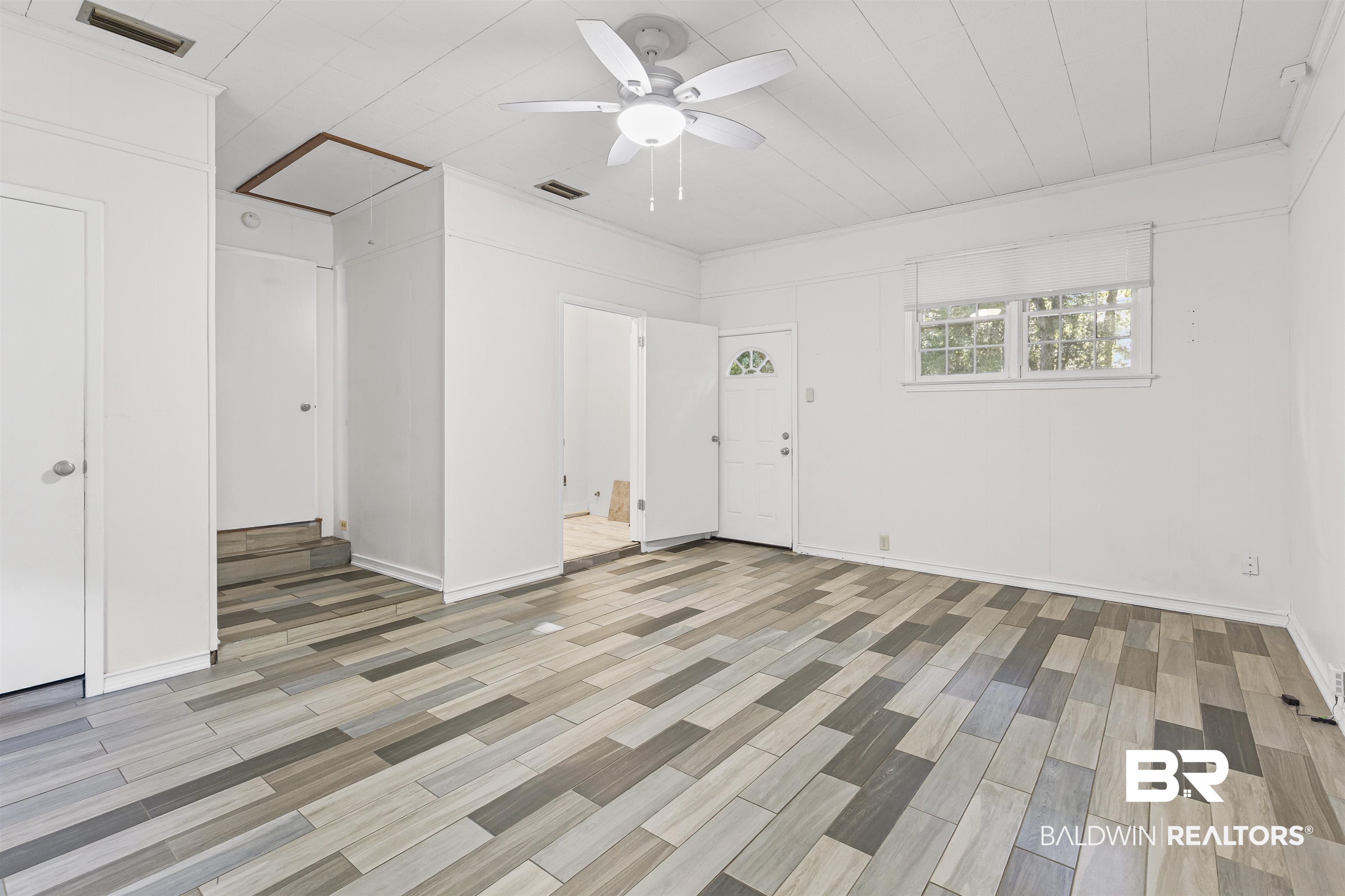 1108 Locarno Street Mobile, AL 36608 - Photo 6 of 24 Entryway with light wood-style floors, a ceiling fan, and crown molding