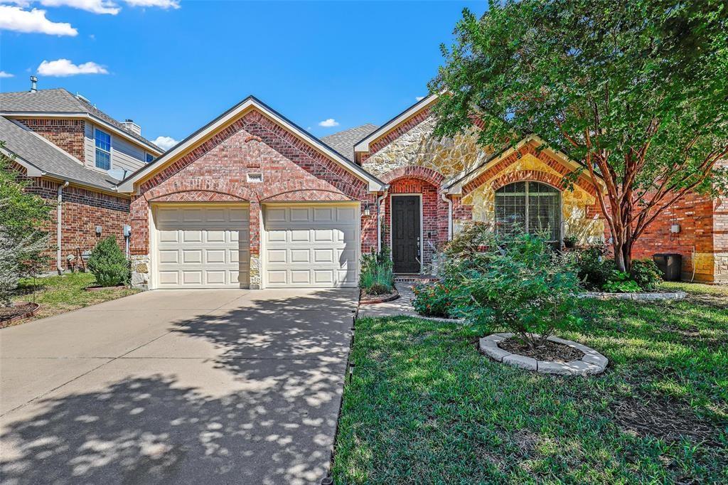 7067 Nantucket Way Grand Prairie, TX 75054 - Photo 1 of 40 a front view of a house with a yard and garage