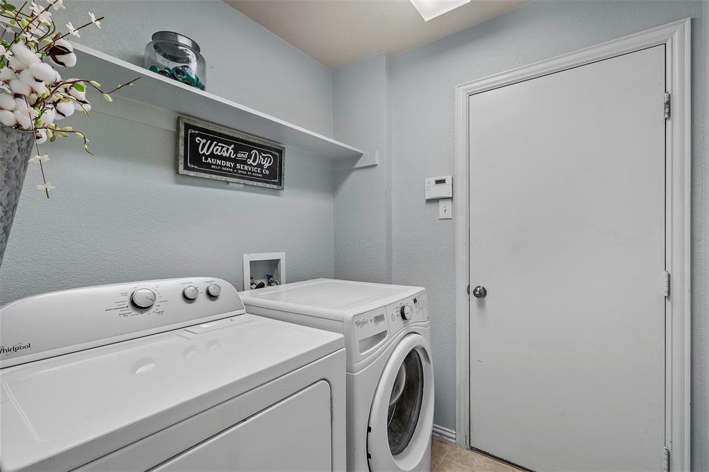 7067 Nantucket Way Grand Prairie, TX 75054 - Photo 28 of 40 a utility room with dryer and washer