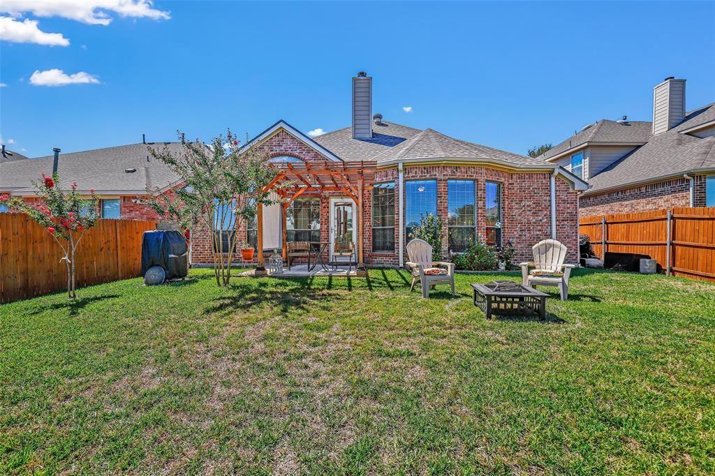 7067 Nantucket Way Grand Prairie, TX 75054 - Photo 30 of 40 a front view of a house with garden