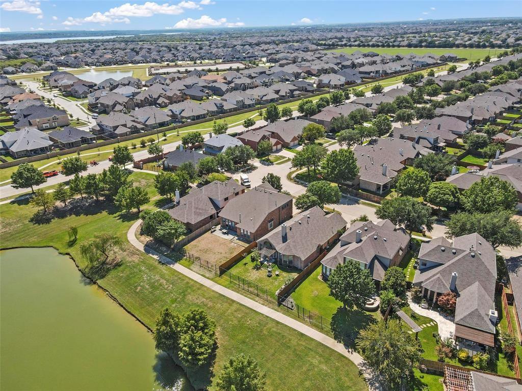 7067 Nantucket Way Grand Prairie, TX 75054 - Photo 36 of 40 an aerial view of residential houses with outdoor space