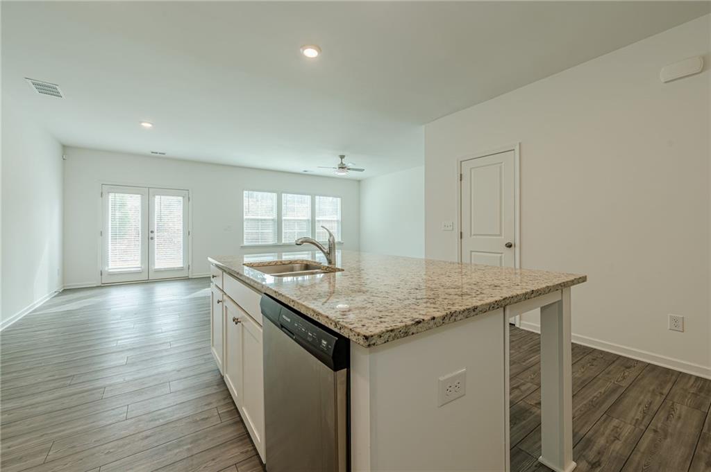 628 Isom Walk Suwanee, GA 30024 - Photo 12 of 39 a kitchen with a sink and cabinets