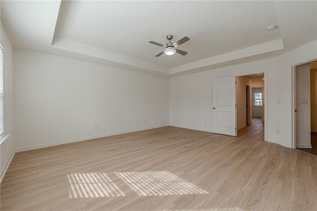 628 Isom Walk Suwanee, GA 30024 - Photo 29 of 39 wooden floor in an empty room