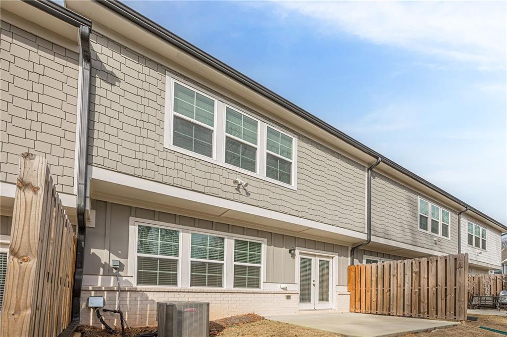 628 Isom Walk Suwanee, GA 30024 - Photo 38 of 39 a front view of a building with large windows