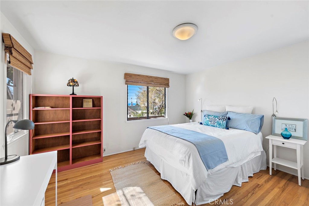 490 Shadow Lane Laguna Beach, CA 92651 - Photo 12 of 18 a bedroom with a bed and a cabinets