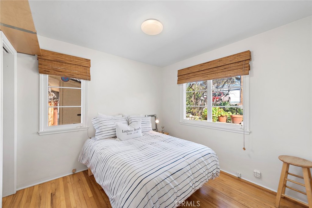 490 Shadow Lane Laguna Beach, CA 92651 - Photo 15 of 18 a bedroom with a bed and a window