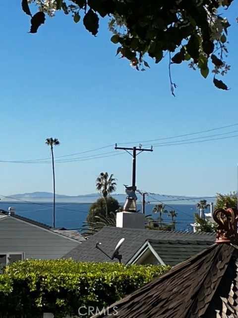 490 Shadow Lane Laguna Beach, CA 92651 - Photo 17 of 18 a view of a terrace with chairs and potted plants