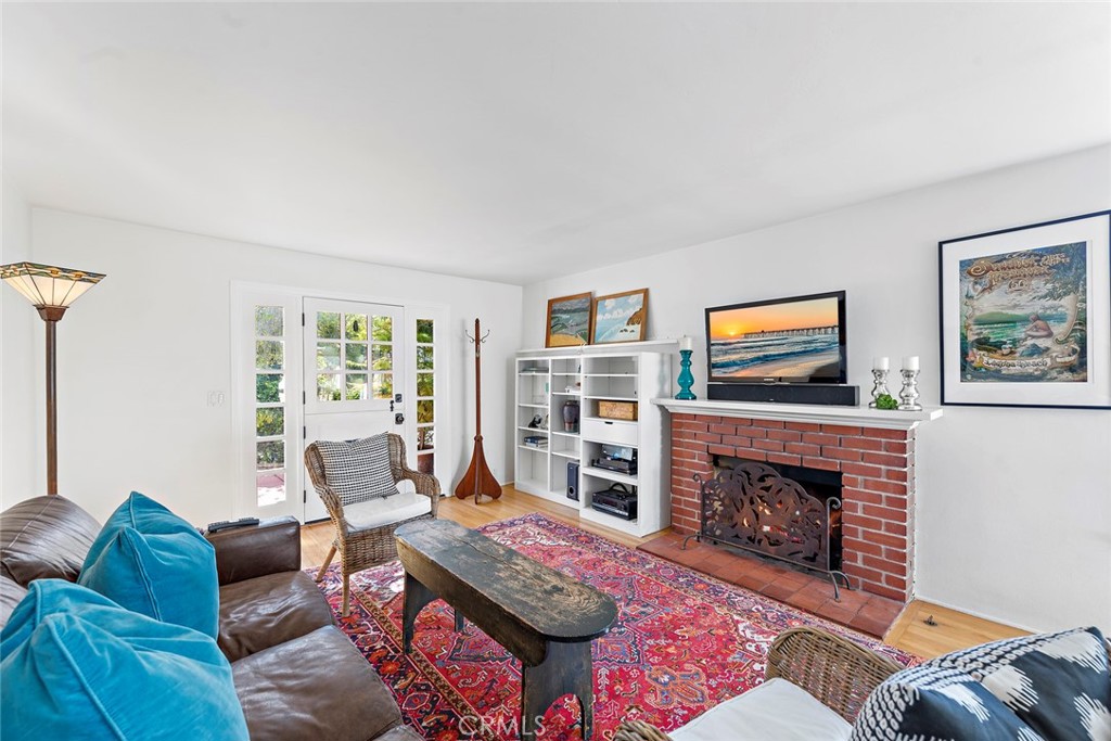 490 Shadow Lane Laguna Beach, CA 92651 - Photo 4 of 18 a living room with furniture and a fireplace