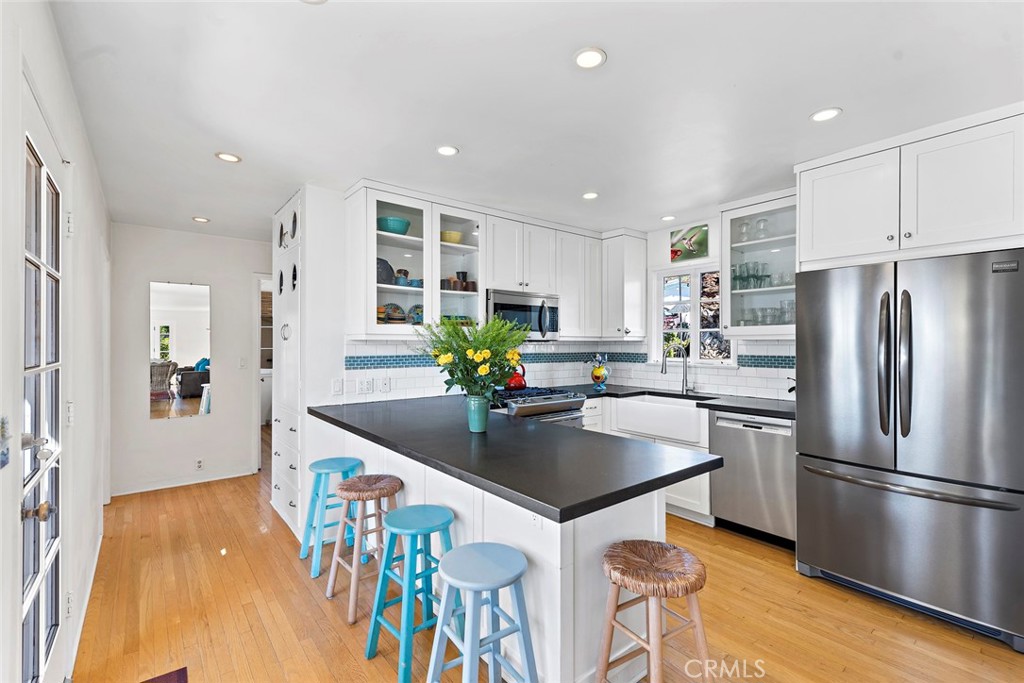 490 Shadow Lane Laguna Beach, CA 92651 - Photo 6 of 18 a kitchen with stainless steel appliances granite countertop a sink a stove a refrigerator and a refrigerator