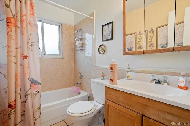 a bathroom with a sink a toilet and a bathtub