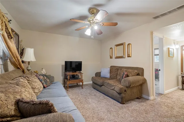 a view of a porch with furniture and a hallway