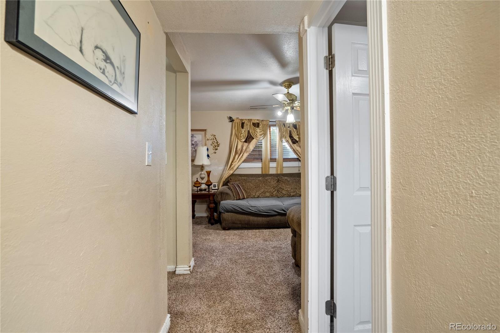 4345 South Chamberlin Colorado Springs Colorado Springs, CO 80906 - Photo 18 of 23 a view of a porch with furniture and a hallway