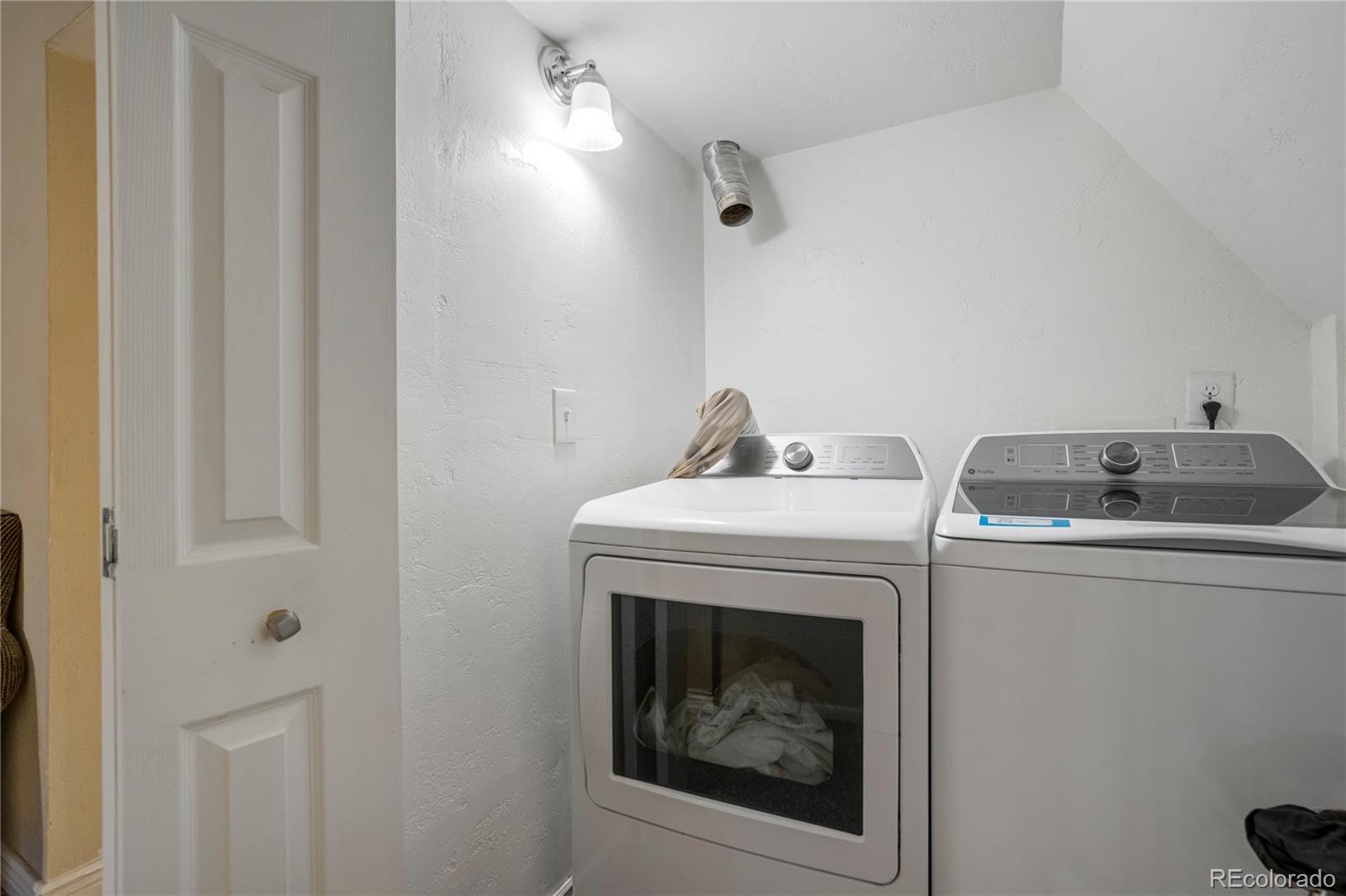 4345 South Chamberlin Colorado Springs Colorado Springs, CO 80906 - Photo 21 of 23 a utility room with dryer and washer