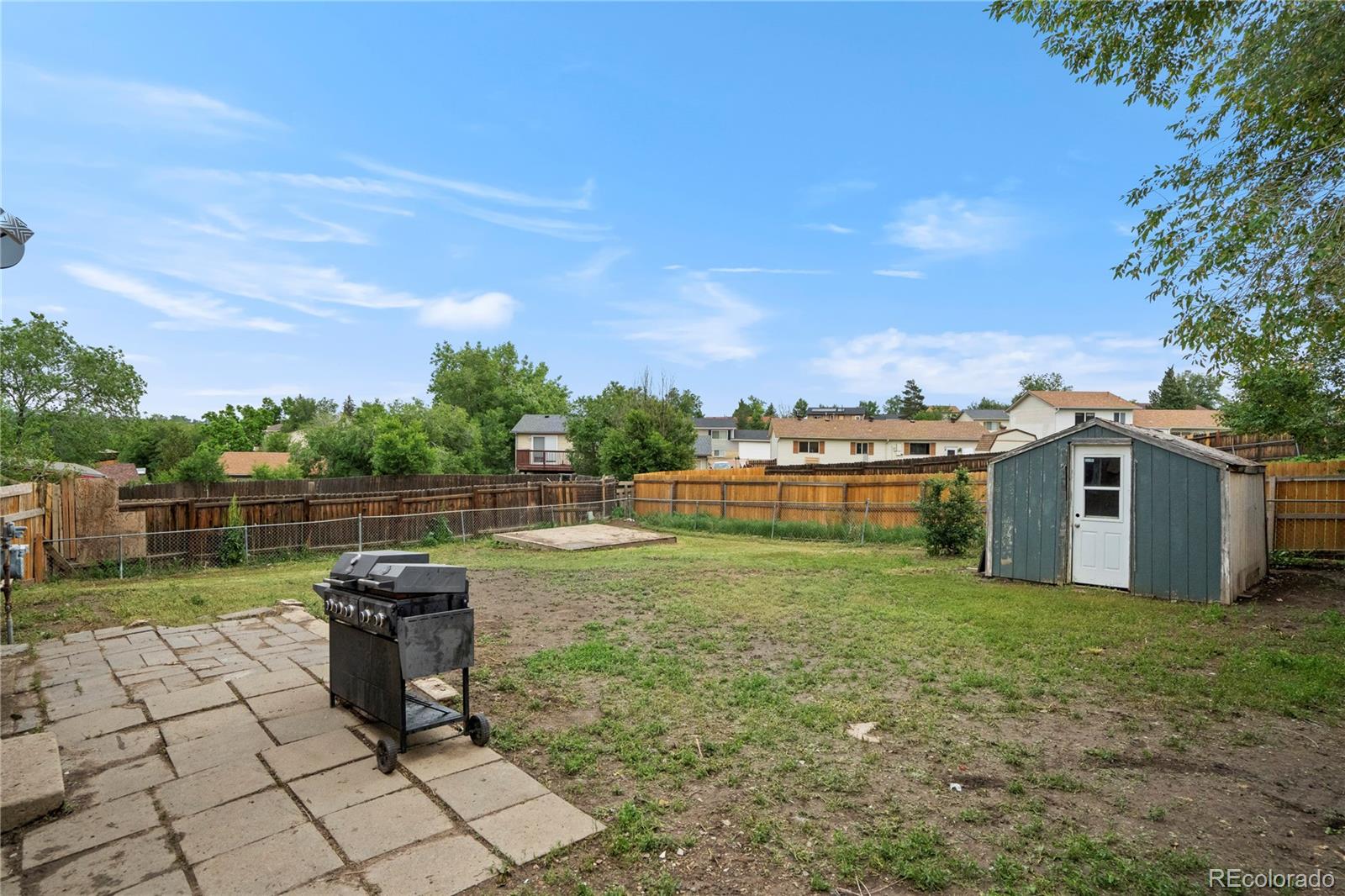 4345 South Chamberlin Colorado Springs Colorado Springs, CO 80906 - Photo 23 of 23 a view of a terrace with a yard
