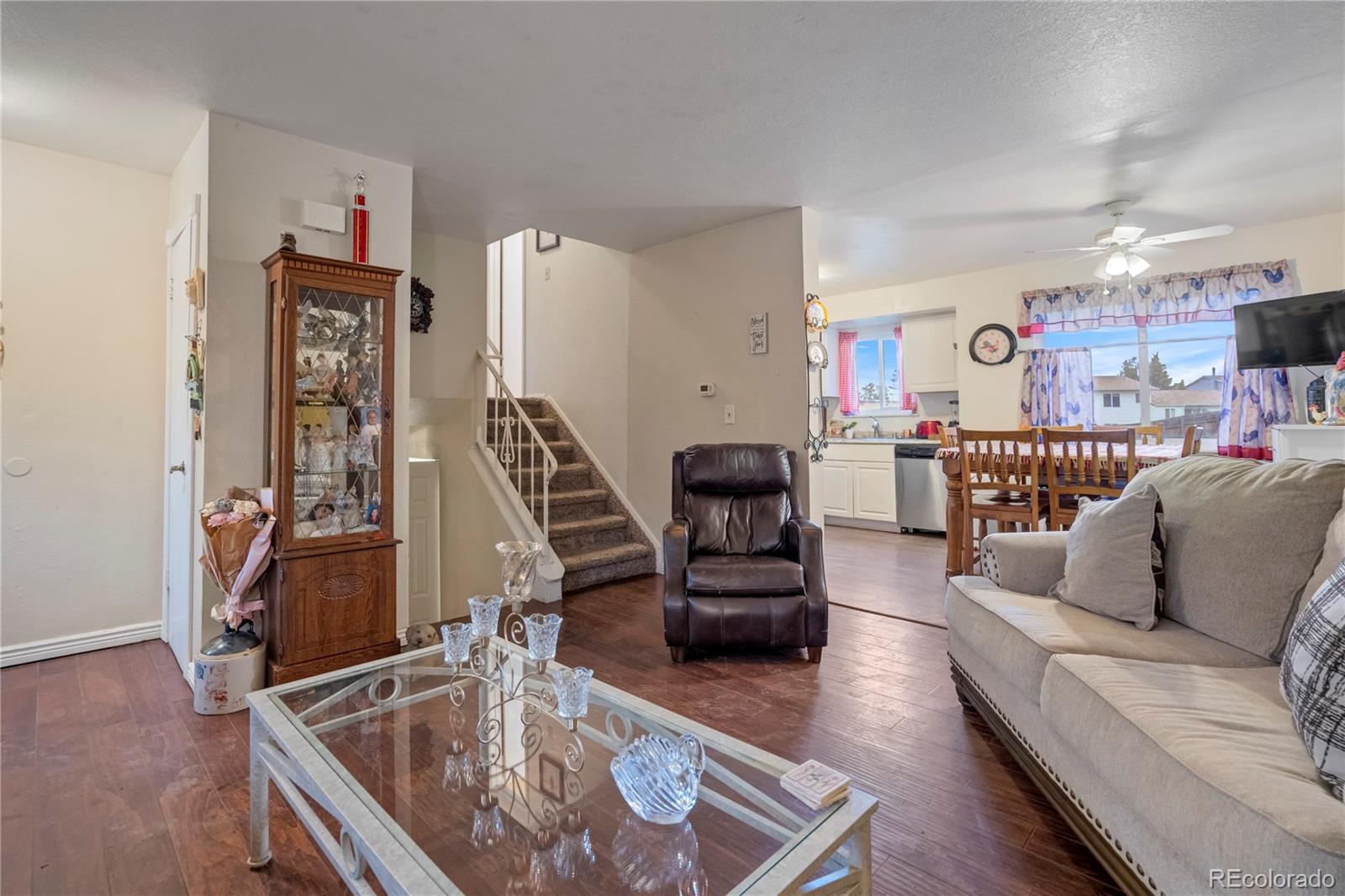 4345 South Chamberlin Colorado Springs Colorado Springs, CO 80906 - Photo 4 of 23 a living room with furniture and a wooden floor