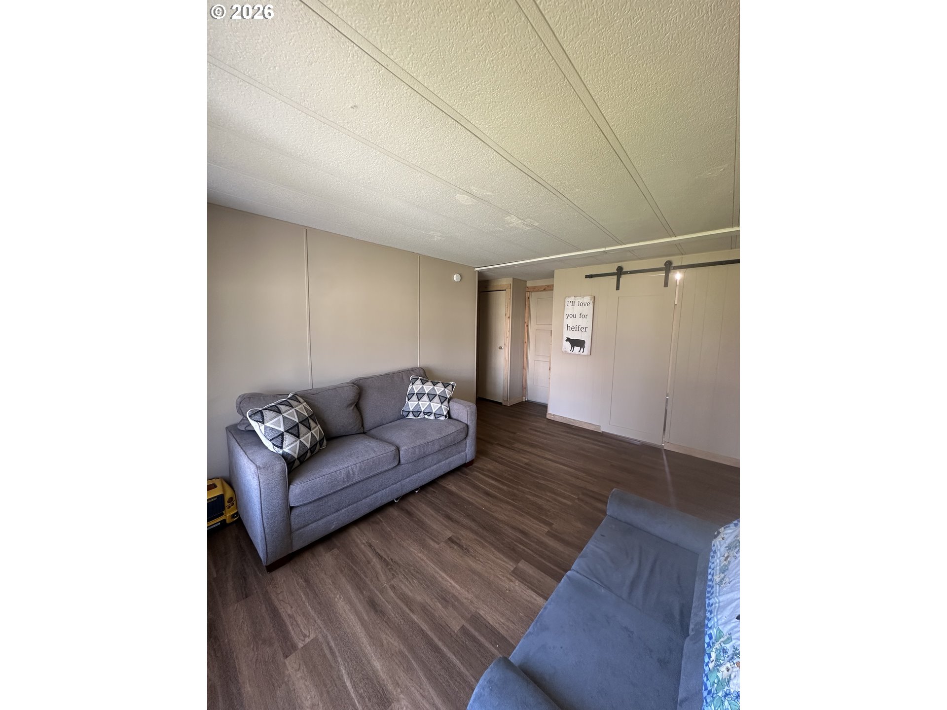 355 North 8th Street Lakeside, OR 97449 - Photo 15 of 22 a living room with furniture and a couch
