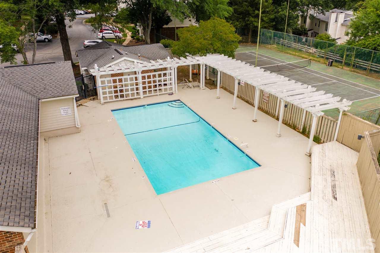 7744 Falcon Rest Circle Raleigh, NC 27615 - Photo 2 of 22 a view of a balcony with chairs