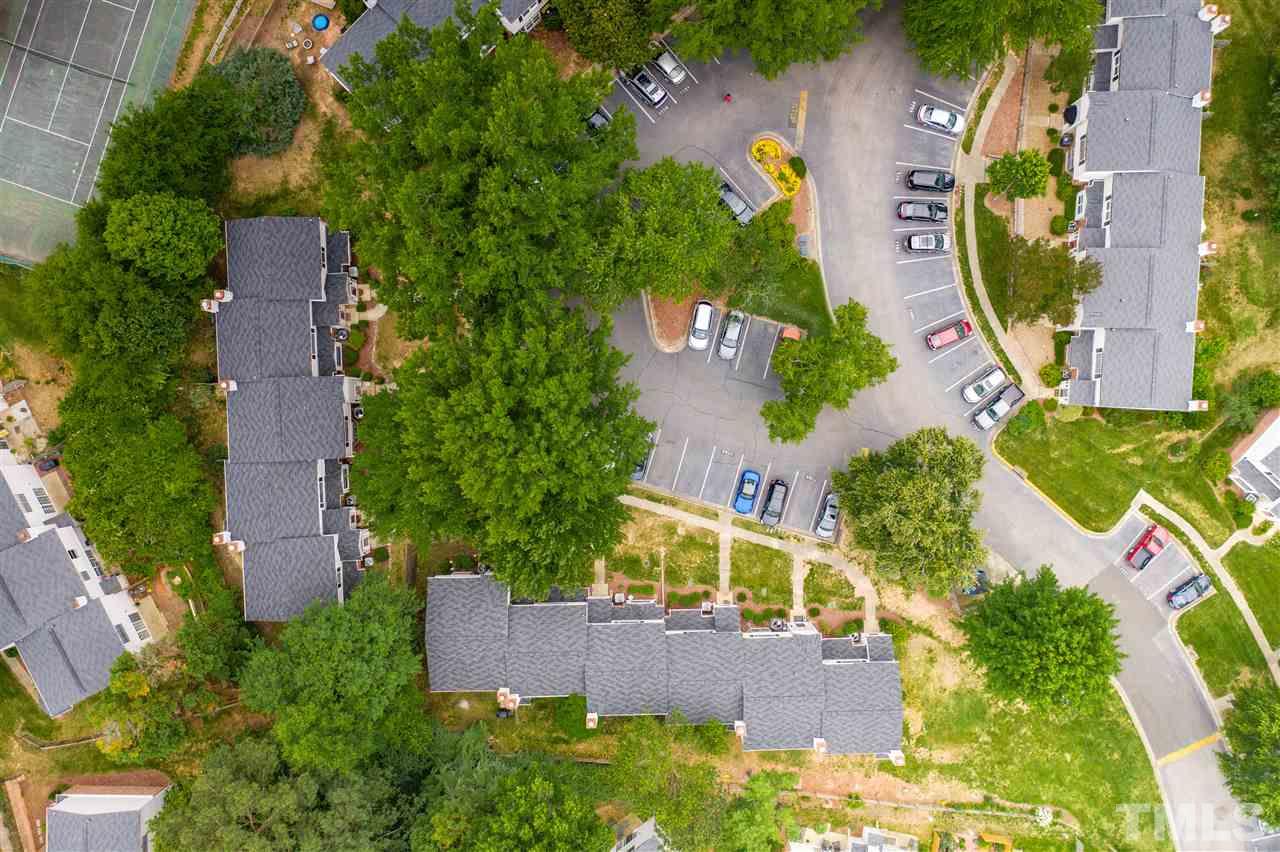 7744 Falcon Rest Circle Raleigh, NC 27615 - Photo 5 of 22 an aerial view of a house with outdoor space and lake view