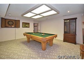 1400 South Wilson Hill Road Mill Spring, NC 28756 - Photo 14 of 24 a room with pool table and windows
