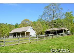 1400 South Wilson Hill Road Mill Spring, NC 28756 - Photo 20 of 24 a view of a house with a yard