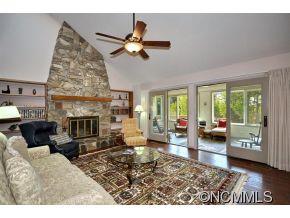 1400 South Wilson Hill Road Mill Spring, NC 28756 - Photo 3 of 24 a living room with furniture and a fireplace