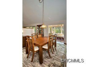 1400 South Wilson Hill Road Mill Spring, NC 28756 - Photo 5 of 24 a view of a dining room with furniture