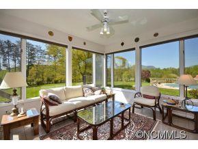 1400 South Wilson Hill Road Mill Spring, NC 28756 - Photo 6 of 24 a living room with furniture and a large window