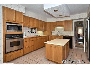 1400 South Wilson Hill Road Mill Spring, NC 28756 - Photo 8 of 24 a kitchen with a sink cabinets and appliances