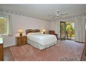 1400 South Wilson Hill Road Mill Spring, NC 28756 - Photo 10 of 24 a bedroom with a bed and window