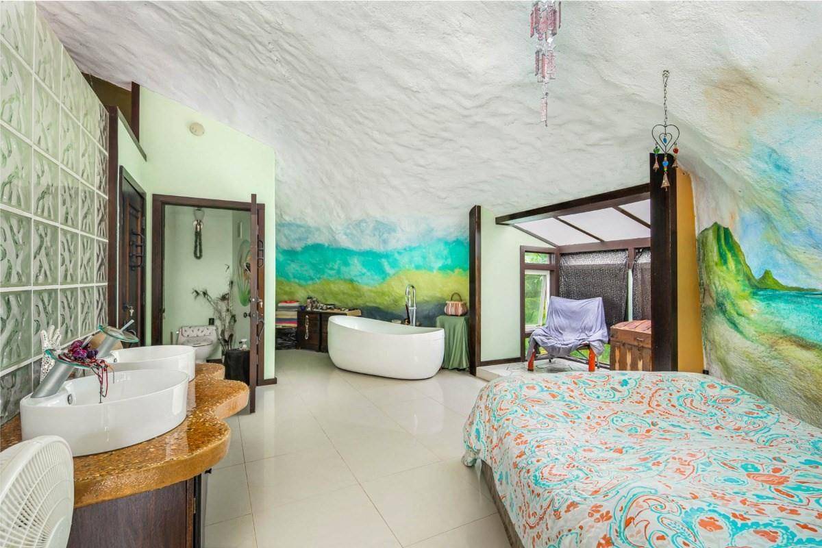 5390 Menehune Road Waimea, HI 96796 - Photo 11 of 22 a bed room with a bed and a couch