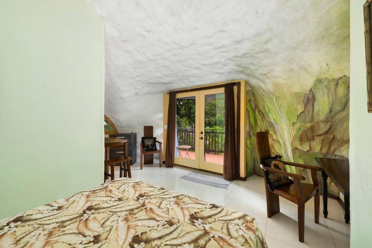 5390 Menehune Road Waimea, HI 96796 - Photo 14 of 22 a bedroom with a bed and a chair