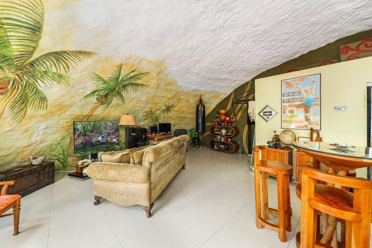 5390 Menehune Road Waimea, HI 96796 - Photo 6 of 22 a living room with furniture and a flat screen tv