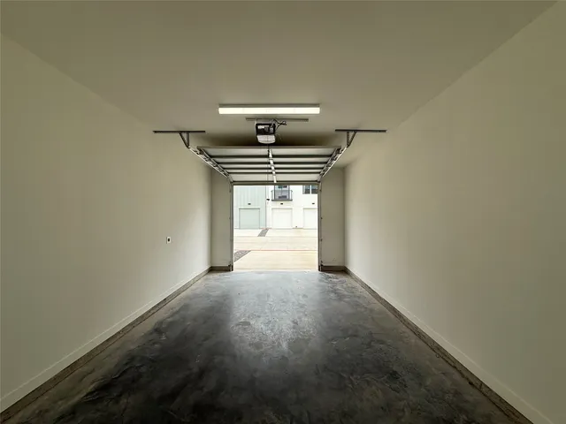 a view of a hallway with a window