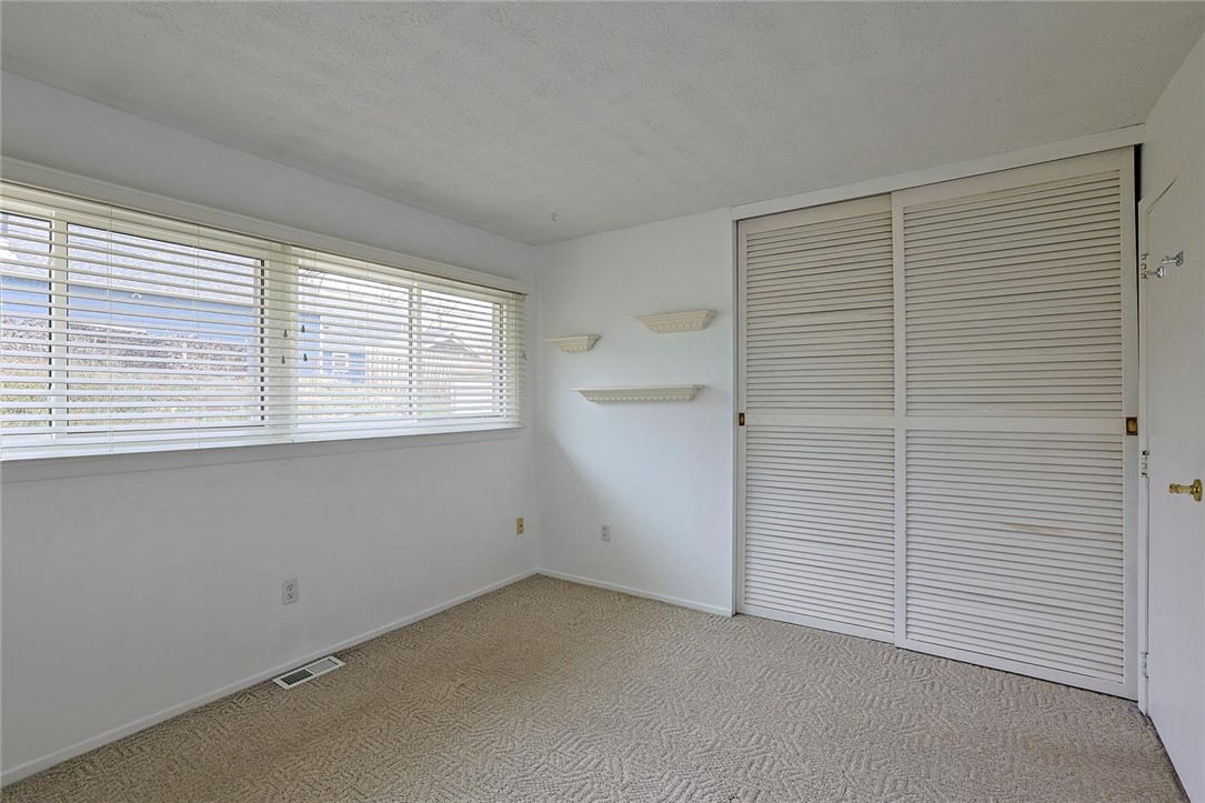 4307 Meadowcroft Road Dayton, OH 45429 - Photo 14 of 26 This cozy bedroom offers bright natural light and ample closet space, ready for your personal touch.