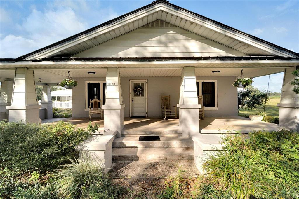a view of swimming pool with outdoor seating