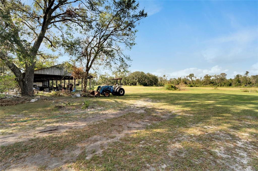 5020 Sydney Road Plant City, FL 33566 - Photo 8 of 33 a view of outdoor space with garden and trees