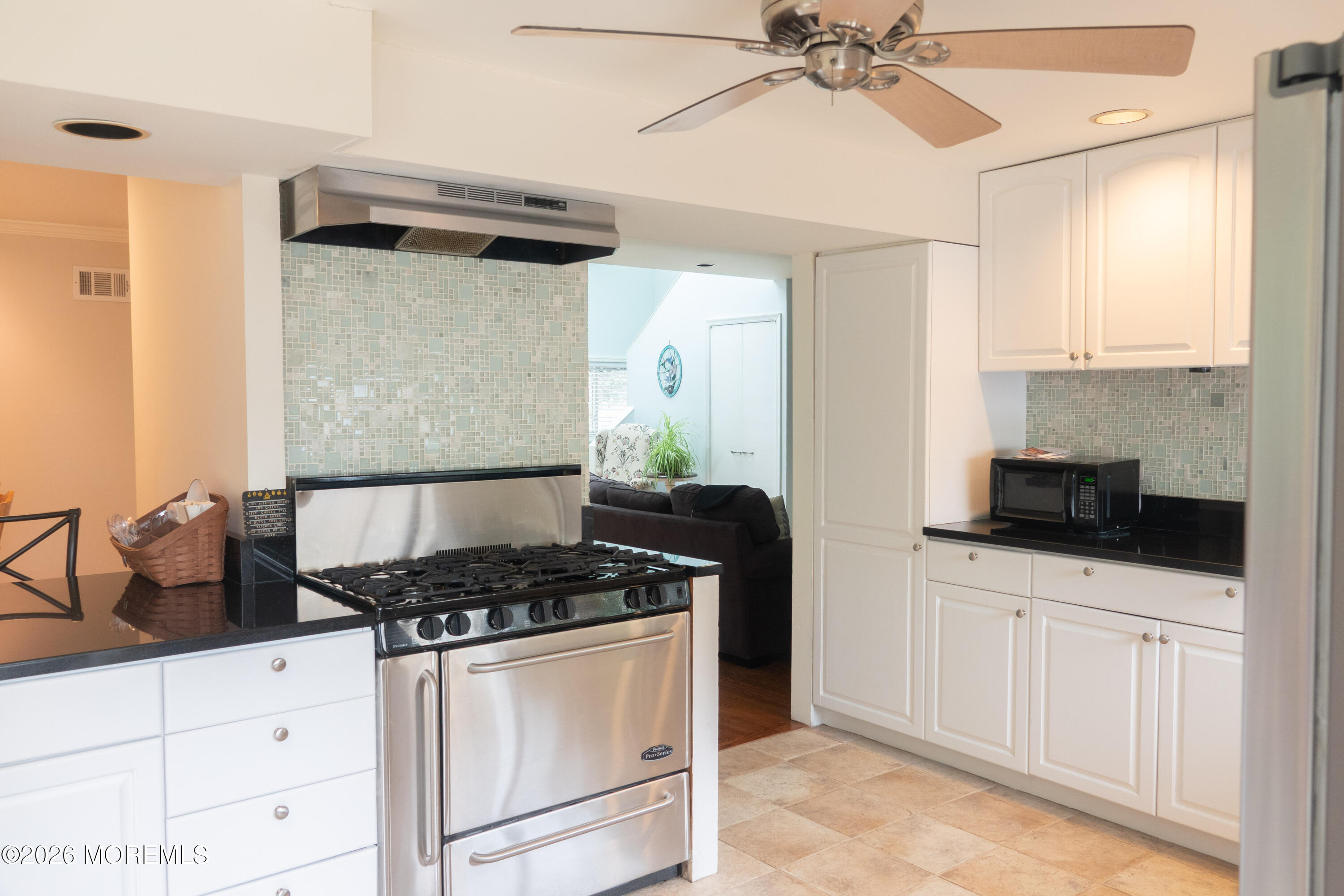 480 Staffa Street Allenhurst, NJ 07711 - Photo 16 of 30 a kitchen with granite countertop a sink and a stove top oven