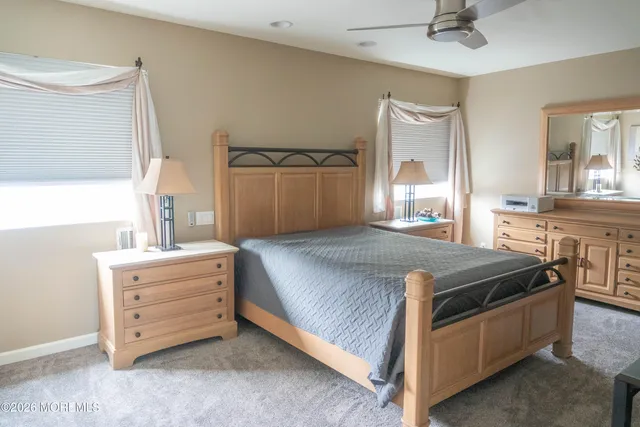 a bed room with a bed and a dresser
