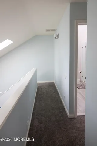 a view of hallway with white walls