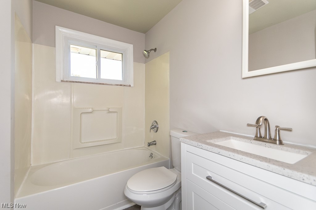 308 Wilson Mills Road Chardon, OH 44024 - Photo 9 of 21 Full bathroom featuring shower / bath combination, vanity with extensive cabinet space, and toilet