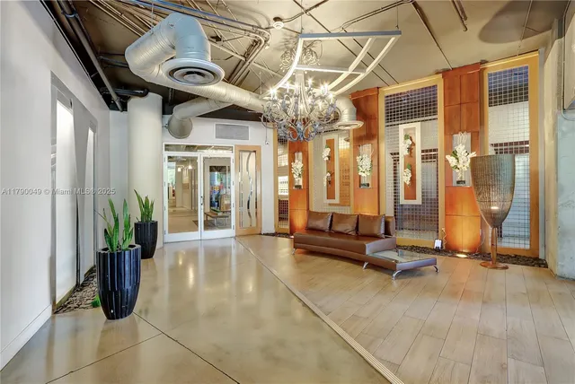 a view of a entryway with furniture and floor to ceiling window
