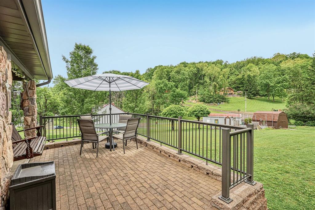 529 Utopia Road Apollo, PA 15613 - Photo 47 of 50 a view of a patio with a table chairs and a yard