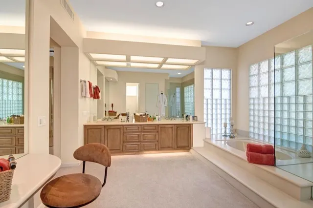 a large living room with furniture and a large window