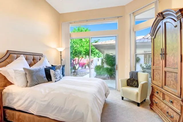 a bedroom with a balcony a bed and a couch