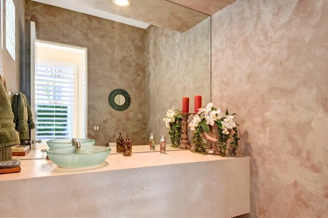 a view of a living room with a large window and couch