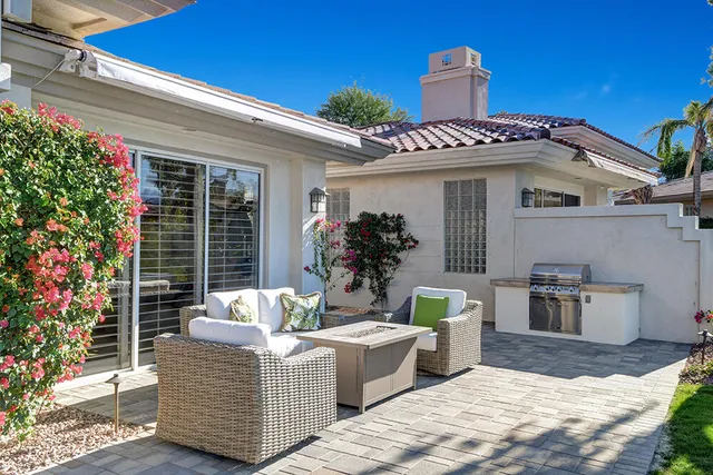 a view of outdoor kitchen and living room