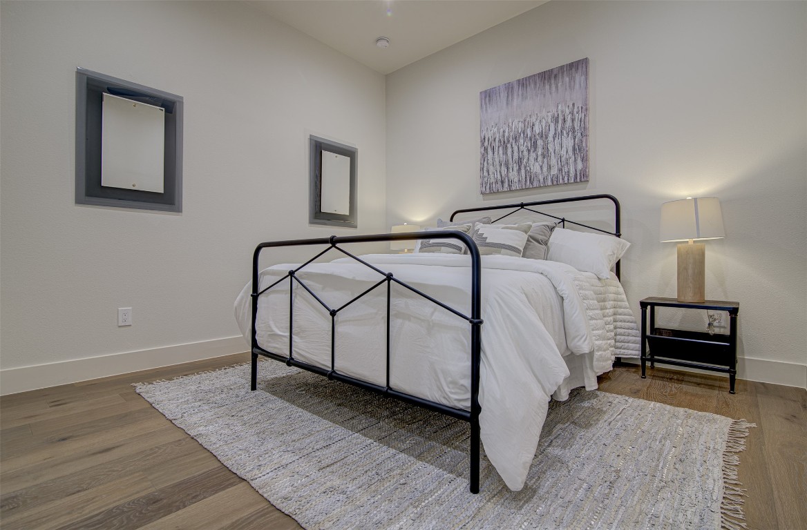 19543 Lakehurst Loop Spicewood, TX 78669 - Photo 18 of 23 a bedroom with a bed and a night stand